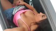 Bimba Barcelona playing in her car next to a road