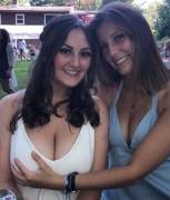 Grabbing her friend's bigger tits