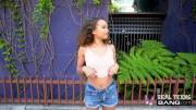 Petite teen flashes her titties right in the middle of a busy street
