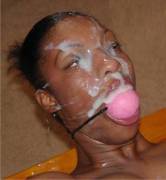 Black girl takes a facial with a ball gag (x-post /r/CumOnBlackGirls)