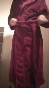 Girl takes off the bathrobe