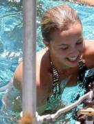 Hayden Panettiere slips a nip getting out of a pool