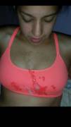 On her pink sports bra