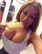 Busty asian girl licking ice cream