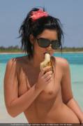 Enjoying a banana on a tropical seashore