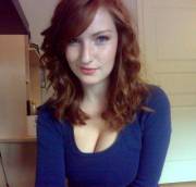 Blue shirt, red hair