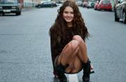 Pretty Brunette Squatting in the Street