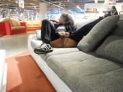 On a couch in a furniture store.