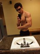 Bicep selfie by the sink