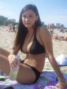 Raven haired beach beauty