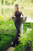 Blonde in a long black evening dress