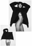 Emily Ratajkowski showing off her black raincoat