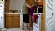 Mom and son heating up the kitchen