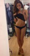 Getting ready to pull off her top