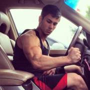 Flexing in his Car