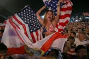 Happy girl with a flag in the middle of a crowd (x-post /r/GirlsWithFlags)