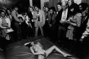 Woman masturbating on a waterbed at Manhattan's Gallery of Erotic Art. Photographed by Charles Gatewood. 1971.