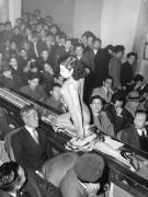 A stripper at a Tokyo striptease show is taken past the audience on a moving plastic conveyor belt, which is lit from underneath by neon lights, 1957 [xpost /r/HistoryPorn]