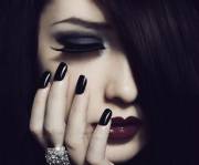 Dark hair, dark eyes, dark nails, dark lips [full face].