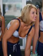 A cheerleader bending forward