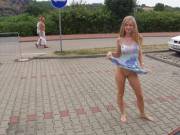 Lifting her dress in a random parking lot