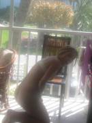 Caught in nothing but a bra on the patio