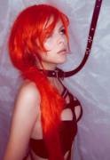 Redhead girl with strap around the neck