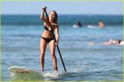 ImageAnnaSophia Robb paddle boarding (x-post /r/WaterGirls)