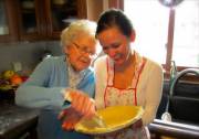 Ethel dives in with one hand while daughter looks on