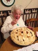 She's getting a mouthful of a huge pie