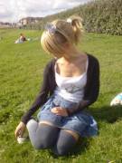 Girl on field in skirt and high socks