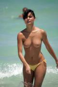 Short-haired topless brunette