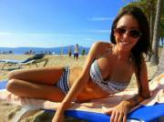 Happy brunette in her sweet bikini