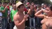 Mexican tv host gets a busty girl to get completely naked in a very busy square (sauce in comments)