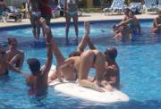 Cunnilingus in the pool with an audience.
