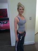 Petite blonde in a grey tank top.