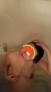 Hot pregnant wife smiling in shower