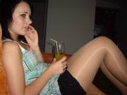 Shiny tan pantyhose legs at a party