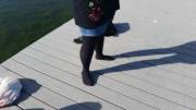 My girl in black tights! Feet hanging in the water from the dock