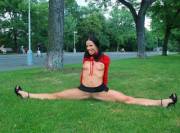 Chick with nice trim doing splits in a park