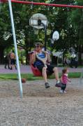 Adult-sized baby swings from a park in Portland [x-post r/pics]