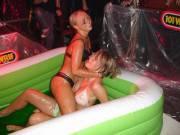 Girls in bikini are wrestling in jello