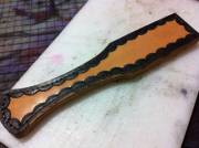 Hand stitched, tooled leather paddles