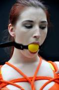 Redhead with yellow ball gag