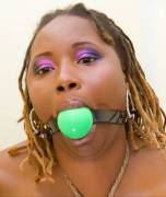 Black girl with green ballgag and blonde dreadlocks