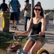 Just a cute brunette with nice boobs on a cruiser.