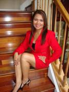 Ravishing Asian milf in a red business outfit.