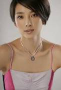 Pretty Asian milf with short hair.