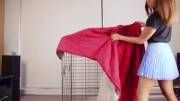 A young lady locks and binds herself inside a cage and gets herself off.