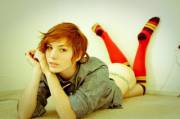 Short hair ginger in colorful socks